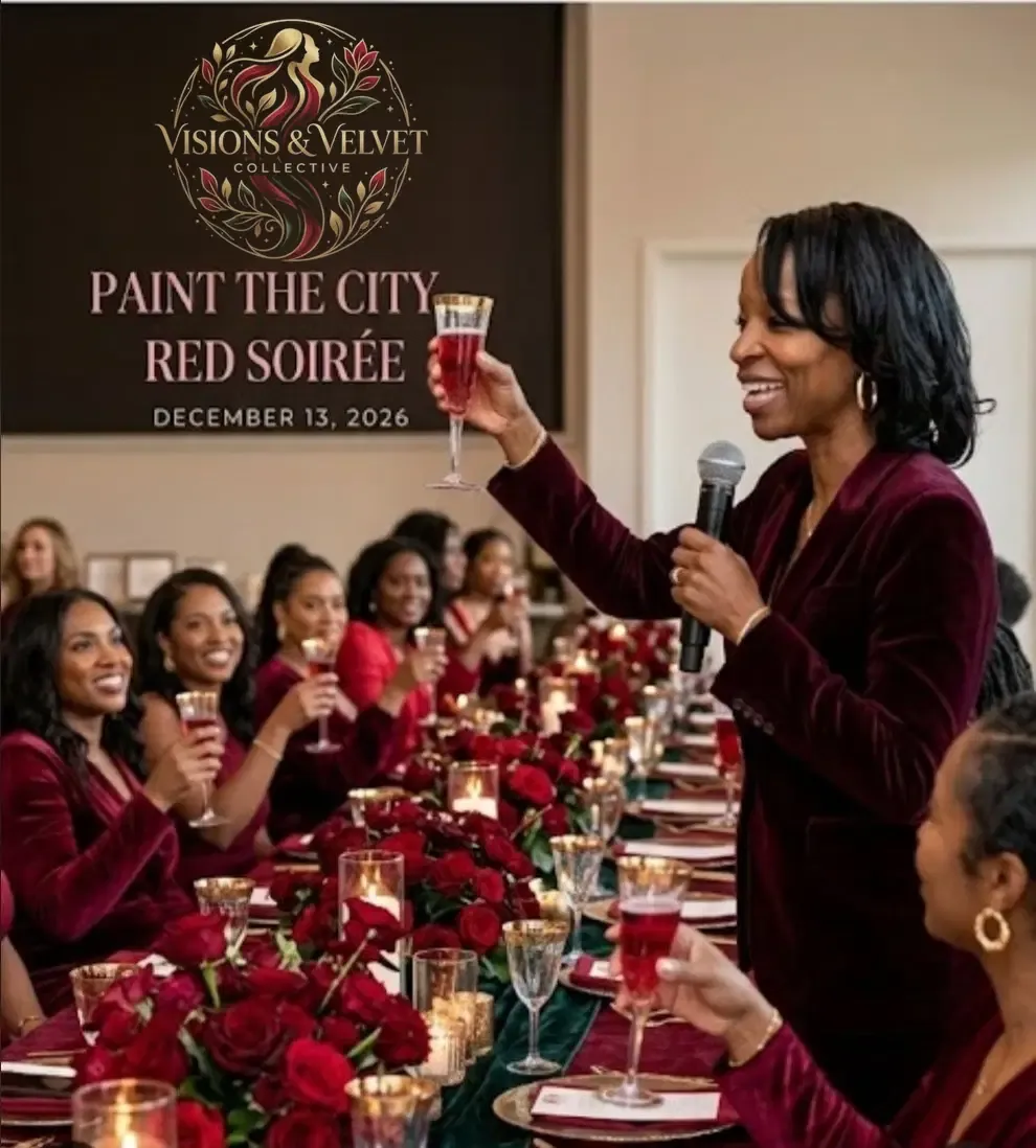 A speaker celebrating with guests at the Paint the City Red Soirée